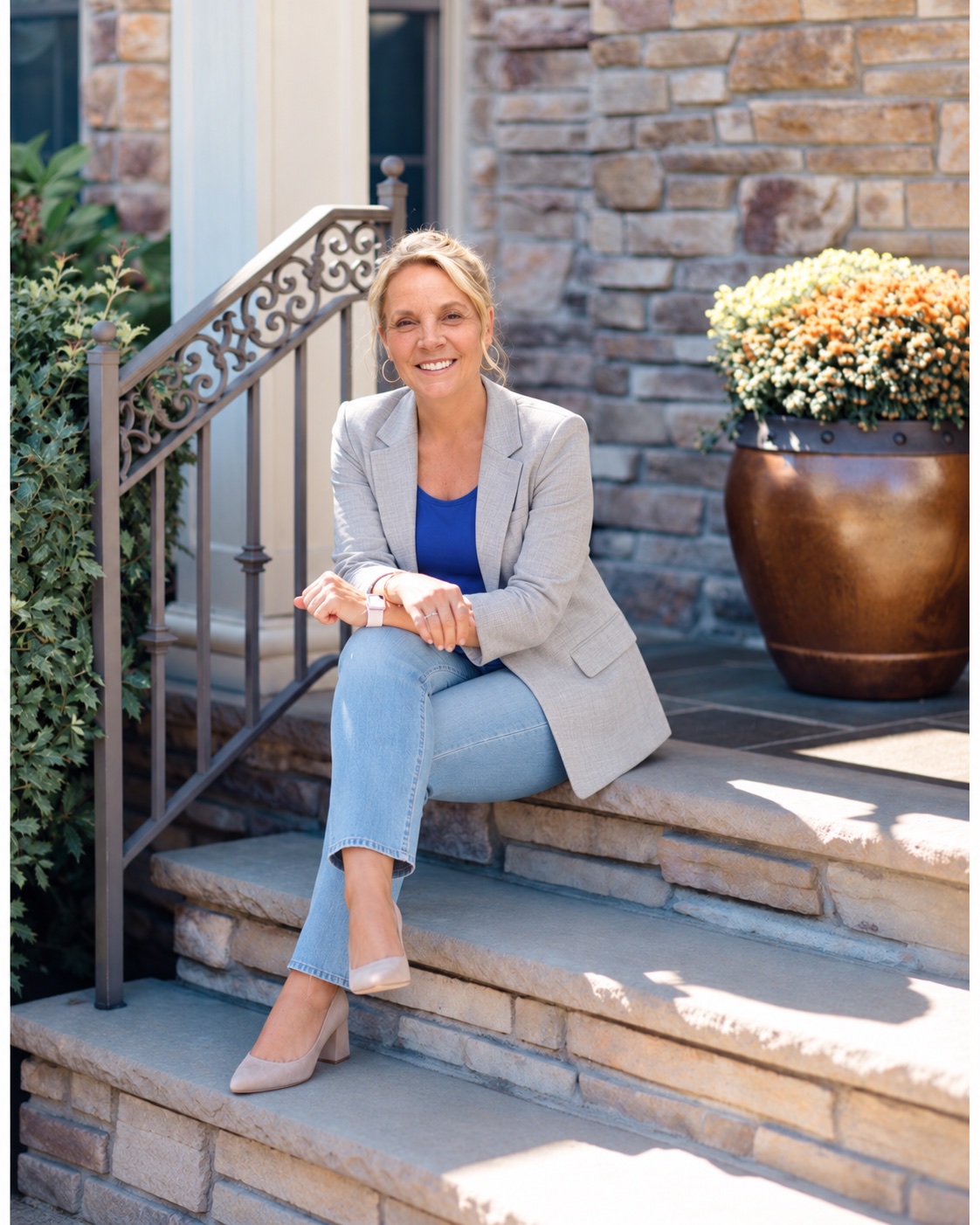 Amy Ambridge sitting on stone steps outside