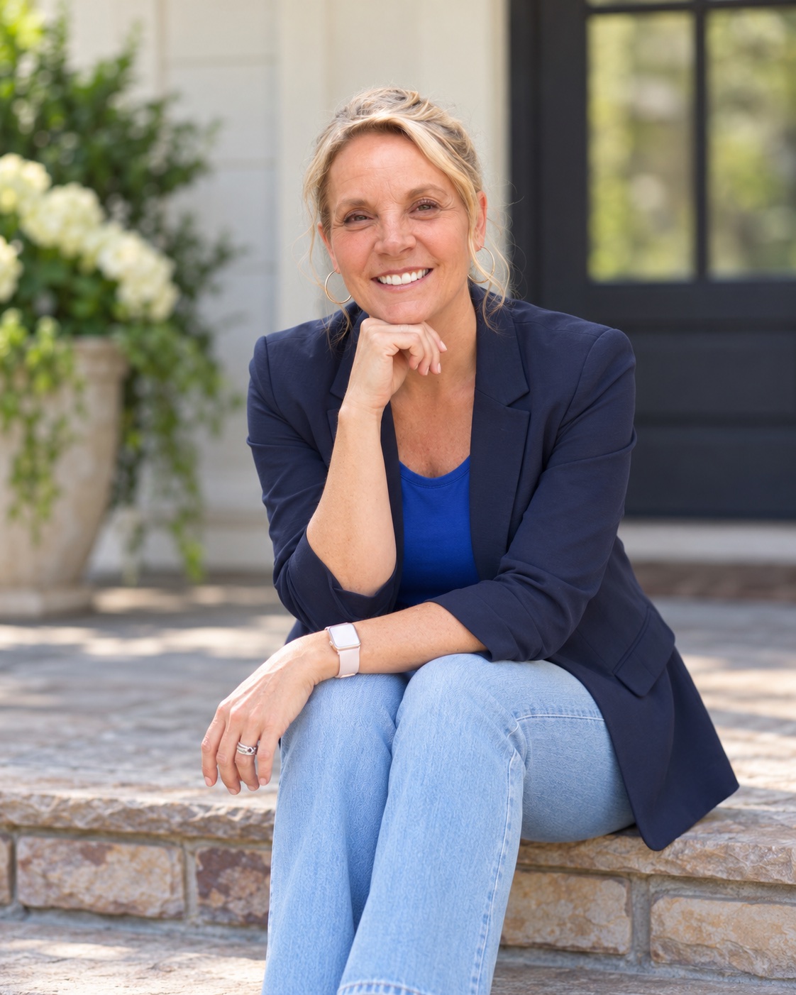Amy Ambridge sitting on stone steps outside